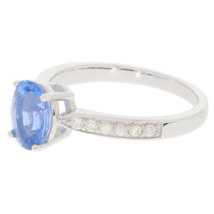Elegant blue gemstone ring in sterling silver, accented with sparkling diamonds for a luxurious look.