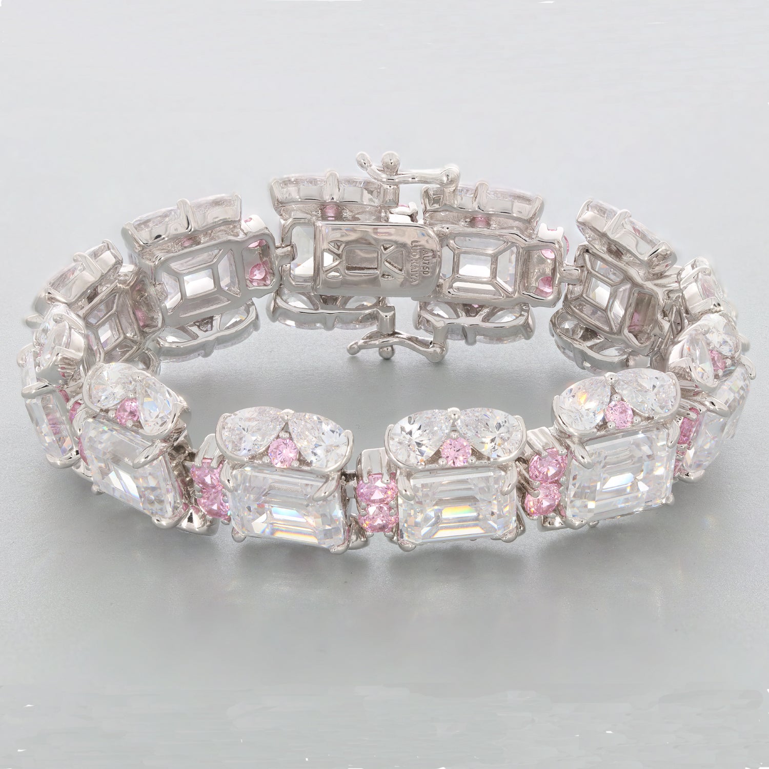 Emerald White Moissanite Sterling Silver Bracelet with pink accents, showcasing a luxurious design and brilliant gemstones.