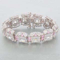 Emerald White Moissanite Sterling Silver Bracelet with pink accents, showcasing a luxurious design and brilliant gemstones.