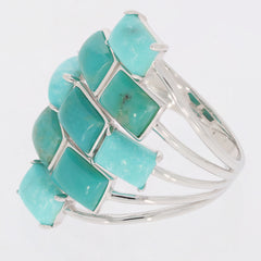 Emerald blue turquoise sterling silver ring showcasing elegant gemstone design and brilliance.