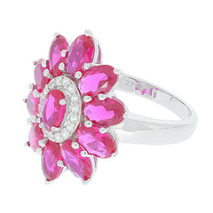 Oval pink sapphire sterling silver ring with floral design and sparkling accents, perfect for elegant style.