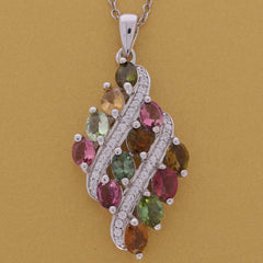 Oval multiple color sapphire sterling silver pendant with accent stones, showcasing elegant design and brilliance.