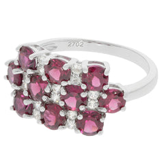 Elegant sterling silver ring featuring cluster of deep pink gemstones with sparkling accents.