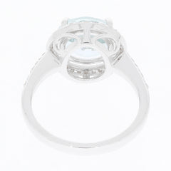 Elegant blue aquamarine sterling silver ring featuring diamond accents, showcasing intricate design and luxurious style.