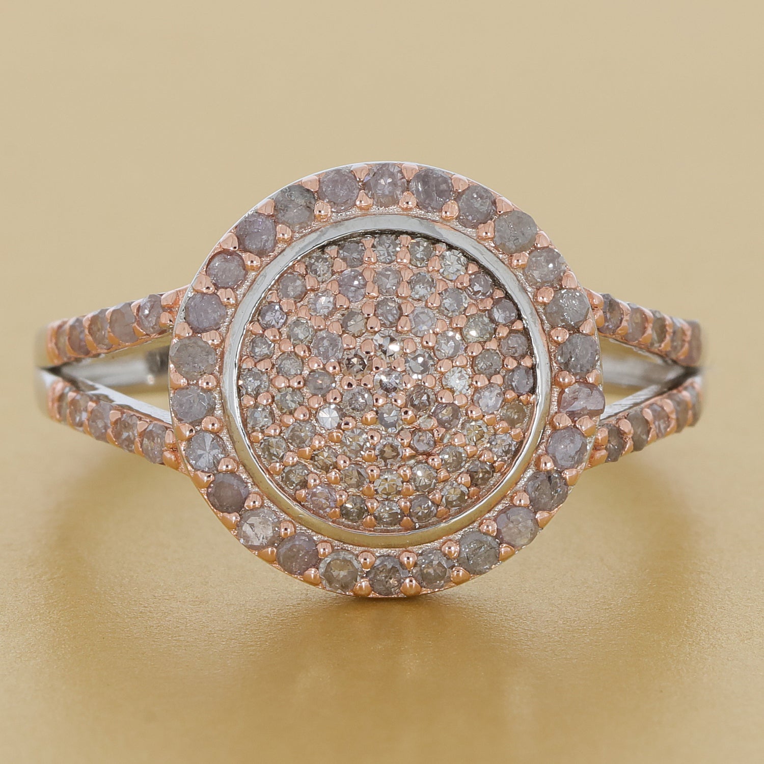 Rose gold sterling silver ring with sparkling diamond accent in a circular design, showcasing timeless elegance.