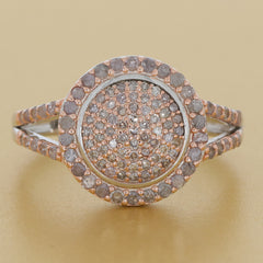 Rose gold sterling silver ring with sparkling diamond accent in a circular design, showcasing timeless elegance.
