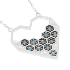 Blue diamond sterling silver necklace in heart shape with sparkling gemstones, perfect for elegant occasions.