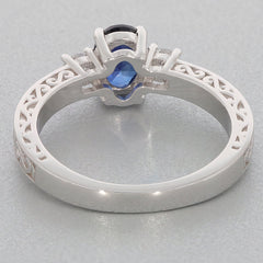 Elegant blue Moissanite sterling silver ring showcasing intricate design with sparkling accents.