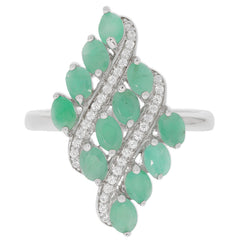 Elegant Sterling Silver Ring featuring multiple oval green emeralds and sparkling accents, perfect for any sophisticated collection.
