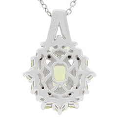 Cushion green Peridot sterling silver pendant with black spinel accent, featuring an intricate design and chain.