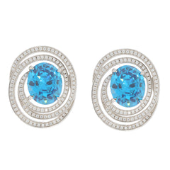Blue Topaz sterling silver earrings with moissanite accents, featuring a luxurious design and sparkling gemstones.