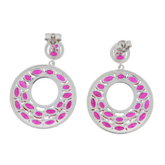 Oval pink sapphire sterling silver earrings featuring a unique hoop design with vibrant pink gemstones.