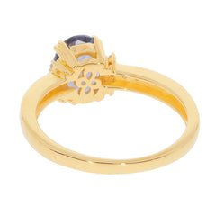 Elegant gold ring featuring a purple sapphire gemstone, showcasing intricate design and luxurious appeal.