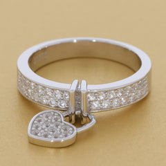 White Moissanite sterling silver ring with heart charm, sparkling gemstones on the band, elegant and luxurious.