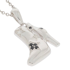 Elegant sterling silver pendant in a shoe design, adorned with black diamonds and sparkling accents.