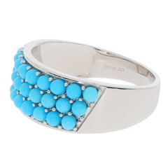 Round blue turquoise sterling silver ring with accent gemstones, showcasing luxury and elegance for any jewelry collection.