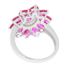 Back view of an elegant oval pink sapphire ring in sterling silver with accent stones, showcasing its intricate design.