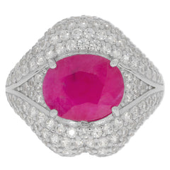Elegant silver ring featuring a large oval red gemstone, surrounded by sparkling accents, perfect for luxury jewelry collection.