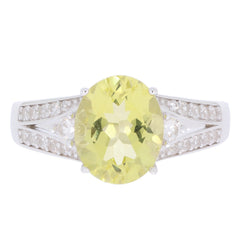 Oval yellow Heliodor sterling silver ring with accent stones, showcasing elegance and luxury.