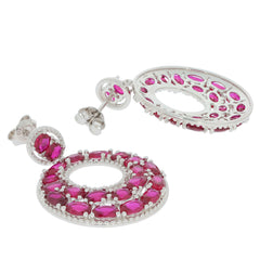 Oval pink sapphire earrings in sterling silver with sparkling accents, perfect for sophisticated style.