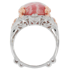 Elegant oval red coral sterling silver ring with accent details, showcasing luxury and sophistication.