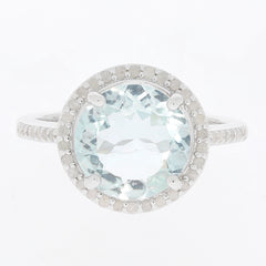 Blue aquamarine sterling silver ring with diamond accent, showcasing an elegant design and sparkling gemstone.