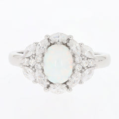 Elegant oval white Moissanite sterling silver ring with accent stones, showcasing timeless luxury and brilliance.