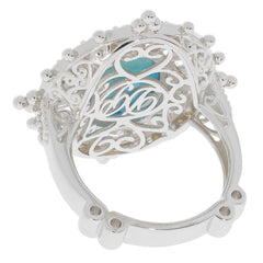 Oval blue turquoise sterling silver ring showcasing intricate detailing and sapphire accent from the underside view.