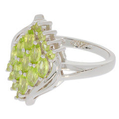 Marquise Green Peridot Sterling Silver Ring with sparkling accents, showcasing elegant design and vibrant gemstones.