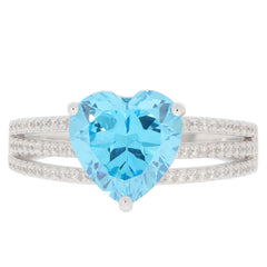 Heart-shaped blue topaz sterling silver ring adorned with sparkling accents, perfect for elegant occasions.