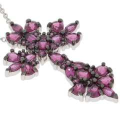 Purple garnet sterling silver pendant featuring a floral design with sparkling gemstones for elegant style.