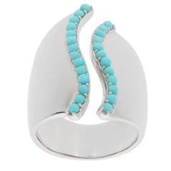 Blue turquoise sterling silver ring featuring elegant curves and accent bead details, perfect for sophisticated style.