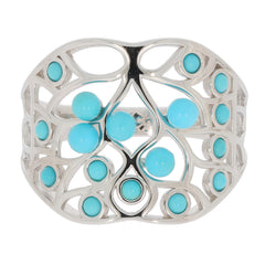 Round Blue Turquoise Sterling Silver Ring featuring intricate design and sparkling turquoise accents.