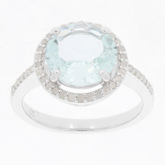 Blue aquamarine sterling silver ring with diamond accent, showcasing elegance and luxury.