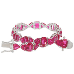 Elegant red ruby sterling silver bracelet showcasing sparkling gemstones and a luxurious design.