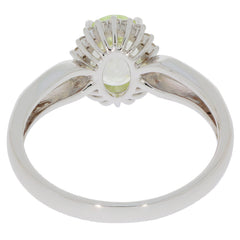 Green Peridot 14K White Gold Ring with Diamond Accent, showcasing elegant gemstone design and polished finish.