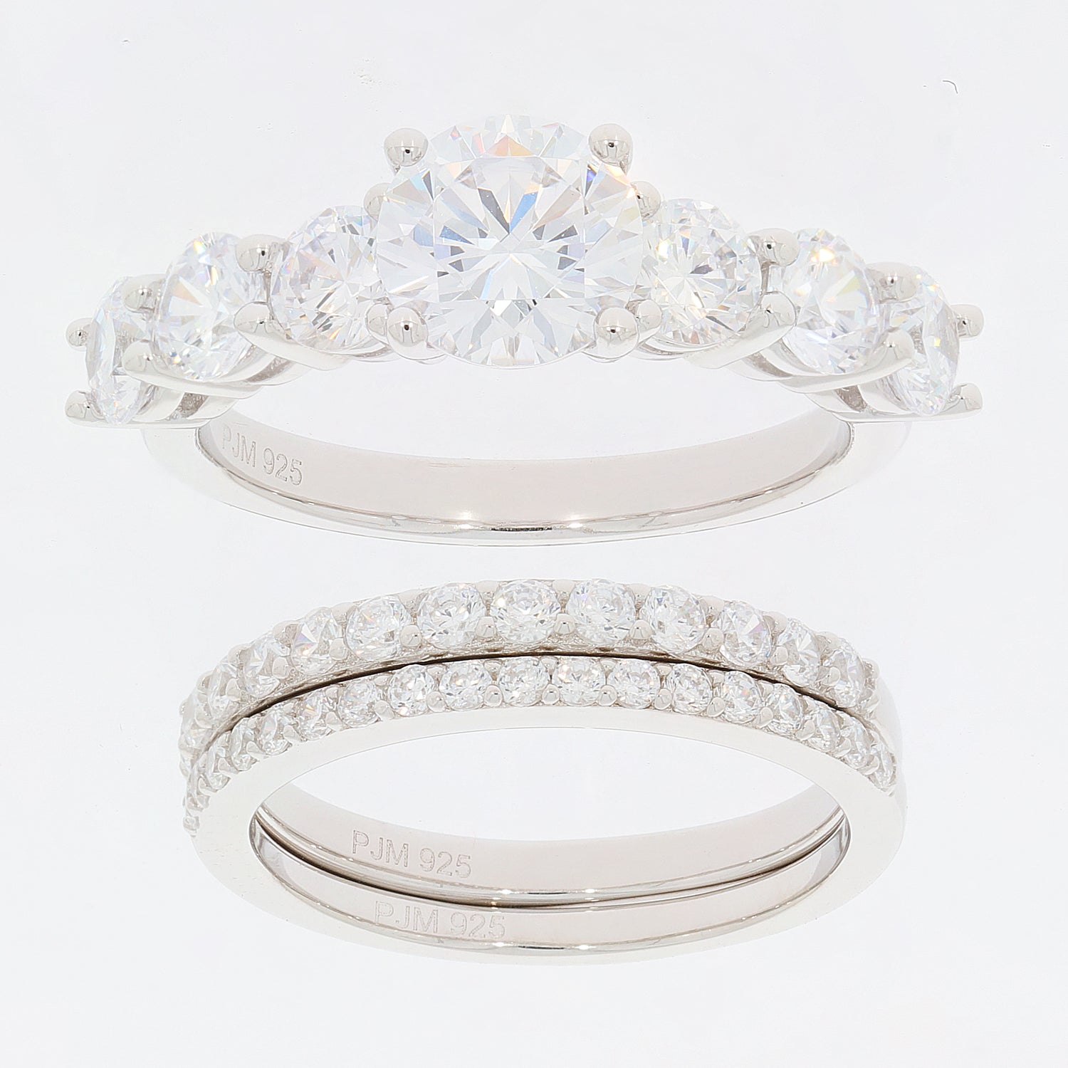 Round white Moissanite sterling silver ring set featuring a sparkling accent piece and elegant design.