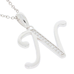 Elegant silver 'N' pendant with sparkling gemstones on a dainty chain necklace.