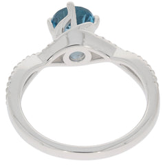 Round blue London topaz ring in sterling silver, showcasing an elegant design and sparkling gemstone from the back view.
