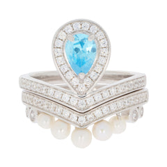 Pear Blue Topaz Sterling Silver Ring with Moissanite and Pearls, showcasing elegant luxury and sophisticated style.