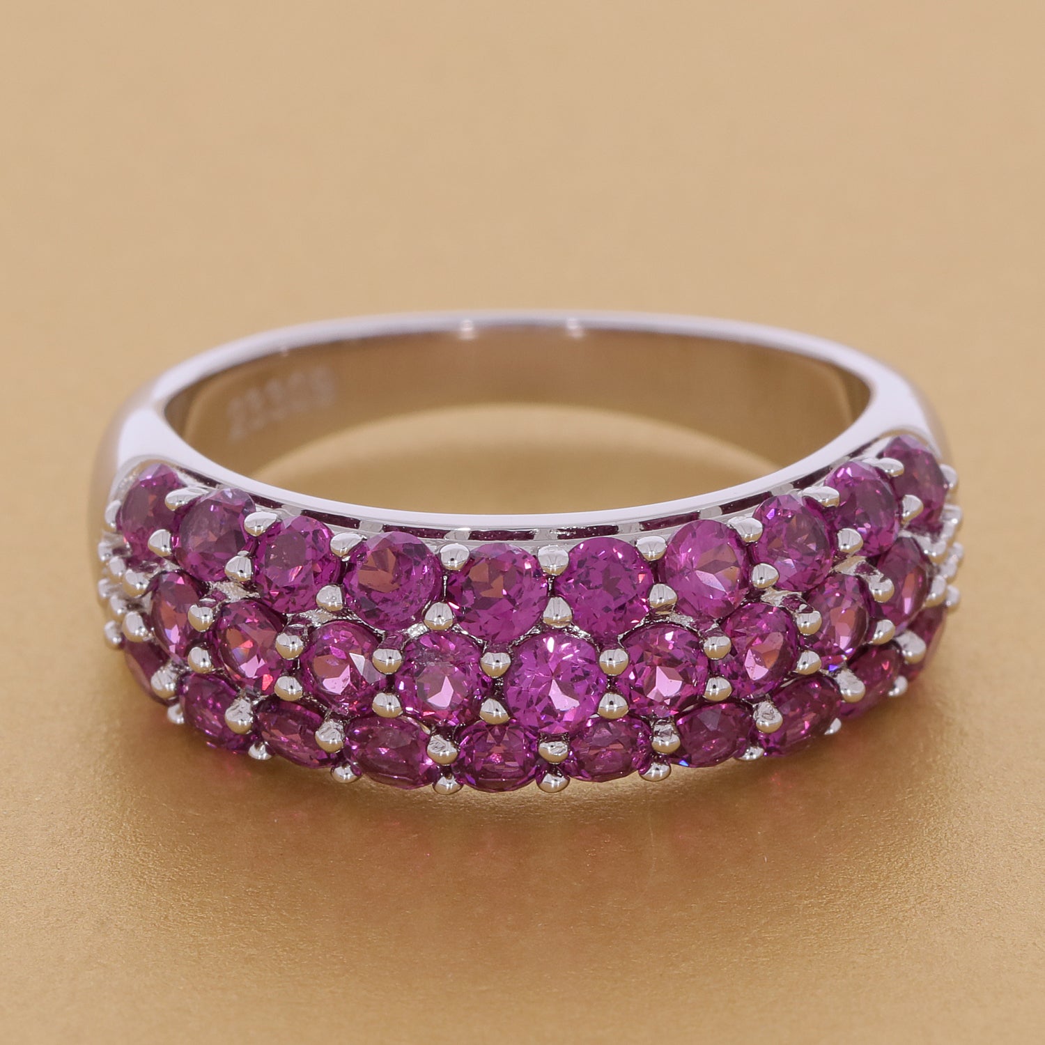 Elegant pink sapphire sterling silver ring with a sparkling gemstone design, showcasing luxury and sophistication.