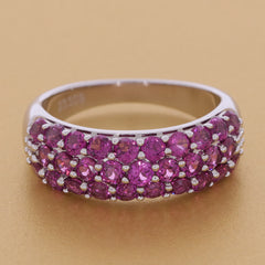 Elegant pink sapphire sterling silver ring with a sparkling gemstone design, showcasing luxury and sophistication.