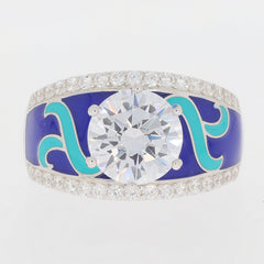 Luxury blue and teal enamel ring featuring a large round diamond center and sparkling accent stones.