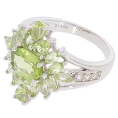 Stunning Green Peridot Sterling Silver Ring with Diamond accents, featuring an elegant floral design.