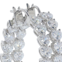 White Moissanite Sterling Silver Earrings featuring sparkling heart-cut gemstones, perfect for elegant occasions.