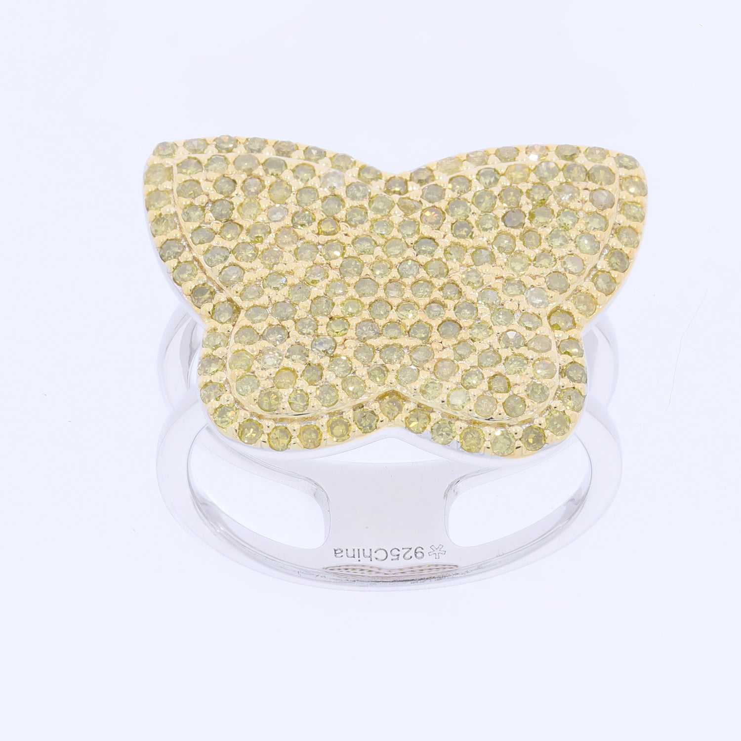 Butterfly-shaped ring with sparkling yellow gemstones on a sterling silver band.