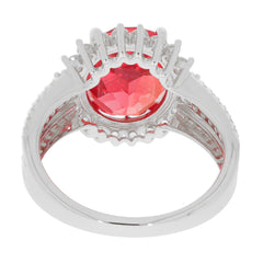 Elegant oval red spinel sterling silver ring with a sparkling gemstone accent, showcasing luxurious craftsmanship.
