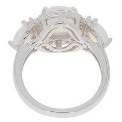 Elegant white opal sterling silver ring with accent stones, showcasing its unique design and craftsmanship from behind.
