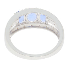 Elegant blue tanzanite sterling silver ring interior view, showcasing sparkling gemstones and polished metal.