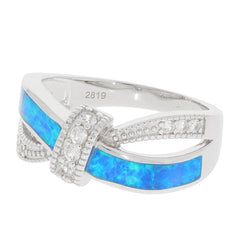 Round blue opal sterling silver ring with accent stones, showcasing elegance and luxury in jewelry.